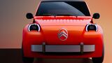Citroën 2CV Concept in Rot aus der Frontansicht mit runden LED-Scheinwerfern, schwarzer Windschutzscheibe und silberfarbenen Designelementen.