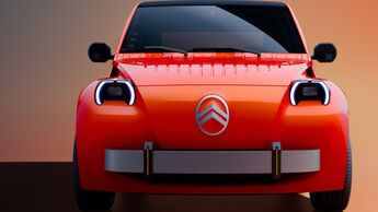 Citroën 2CV Concept in Rot aus der Frontansicht mit runden LED-Scheinwerfern, schwarzer Windschutzscheibe und silberfarbenen Designelementen.
