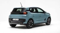 Dacia Spring in hellblauer Lackierung schräg von hinten mit Heckklappe, Rückleuchten und schwarzen Karosseriedetails.