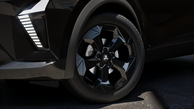 Detailansicht eines Rades und schwarzer Designelemente an der Fahrzeugseite des Mitsubishi ASX Black.