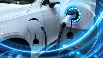 EV Car or Electric vehicle at charging station with the power cable supply plugged in on blurred nature with blue energy power effect. 
