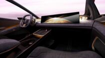 Innenraum des Hyundai IONIQ VENUS Concept mit breitem Display, reduziertem Cockpit und futuristischem Lenkrad