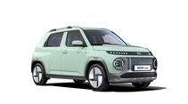 Mintgrüner Hyundai Inster Lounge in schräger Frontansicht vor weißem Hintergrund mit runden LED-Scheinwerfern und Dachreling.