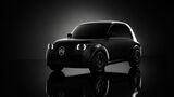 Schwarze Citroën-2CV-Designstudie von Stellantis in Frontansicht auf dunklem Hintergrund mit beleuchteten Rundscheinwerfern.