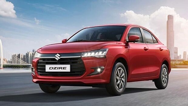 Suzuki Dzire als kompakte Limousine in roter Lackierung in Frontansicht